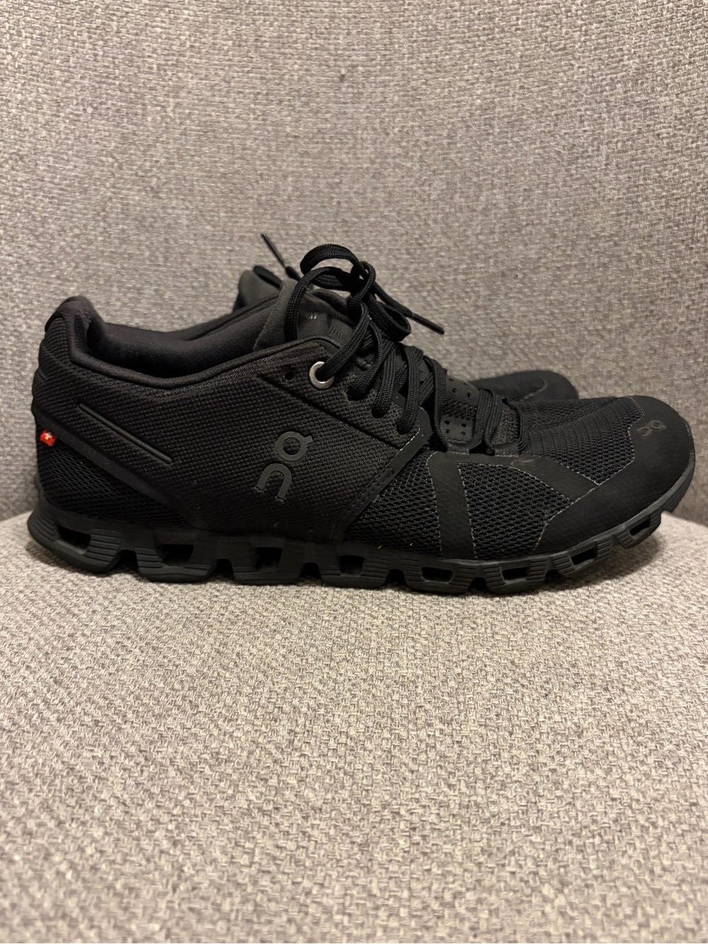 ON CLOUD- woman’s size 7.5 black sneakers,
